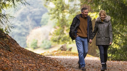 A couple exploring the grounds at Fountains Abbey and Studley Royal Water Garden, North Yorkshire